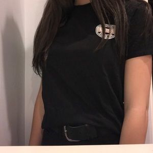 black vans t shirt with cool pink-checker design